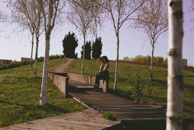 Young woman sitting at park