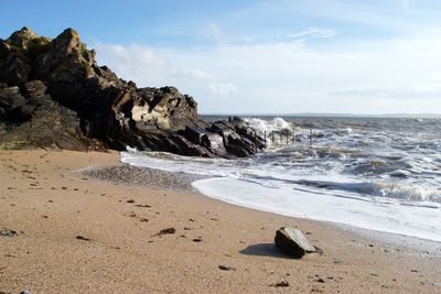 Scenic view of beach against sky