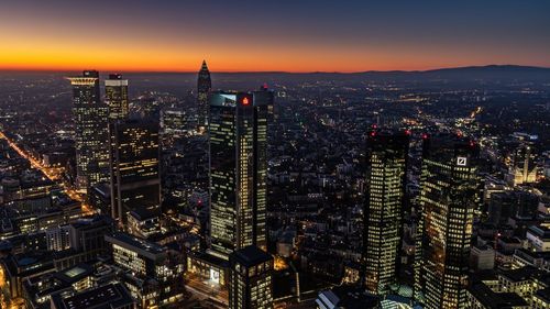 Aerial view of city lit up at night