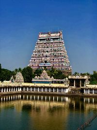 View of temple building against clear blue sky