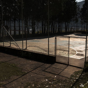 View of soccer field seen through chainlink fence