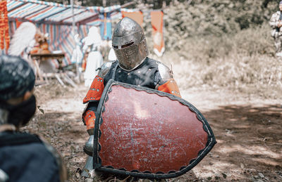 View of warrior standing on field