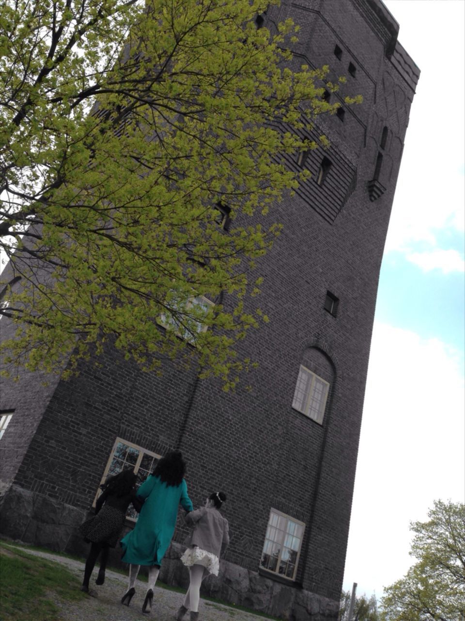 architecture, building exterior, built structure, tree, low angle view, sky, branch, day, outdoors, house, growth, men, tree trunk, building, sunlight, person, green color, history, nature