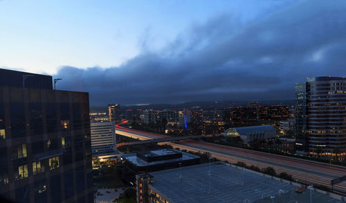 High angle view of illuminated cityscape against sky