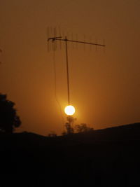 Silhouette landscape against sky during sunset