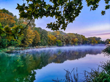 Scenic view of lake against sky during autumn