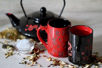 Close-up of tea cups on table
