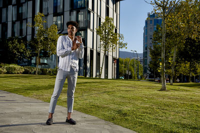 Full length of man standing against plants