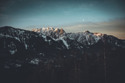 Scenic view of snow against sky at night