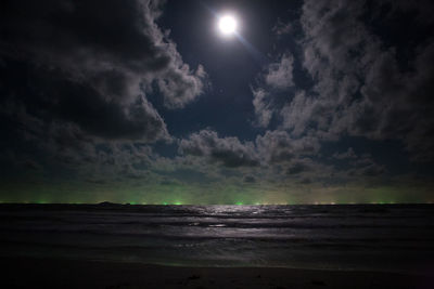 Scenic view of sea against sky at night