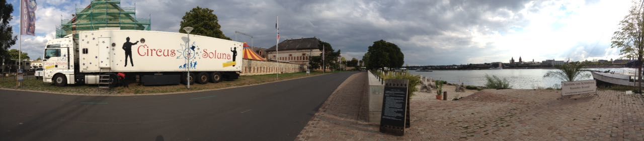 PANORAMIC SHOT OF ROAD BY BUILT STRUCTURES