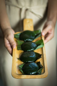 Close-up of man preparing food on cutting board