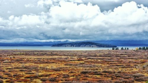 Scenic view of sea against cloudy sky