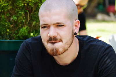 Close-up of young man looking away