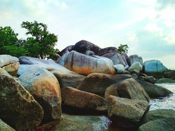 Rocks on shore against sky