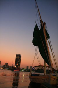 View of ship in sea at sunset