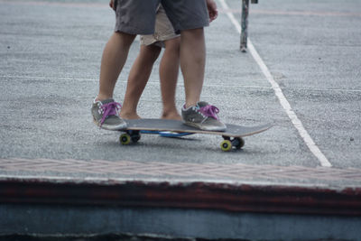 Low section of child on skateboard