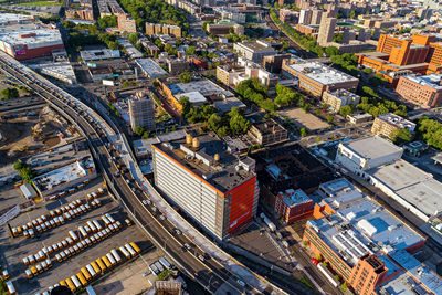 High angle view of vehicles against buildings in city