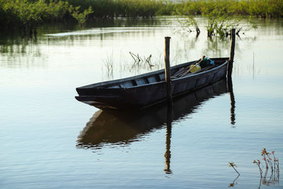 Boat moored in lake