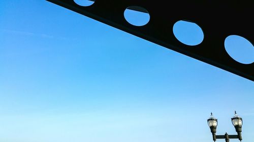 Low angle view of built structure against clear blue sky