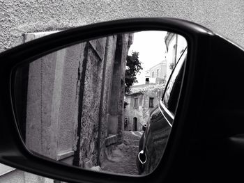 Reflection of car on side-view mirror