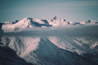 Scenic view of snowcapped mountains against sky