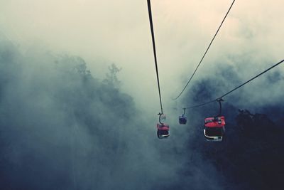 Overhead cable car against sky