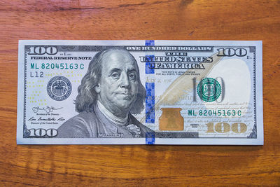Close-up of information sign on table