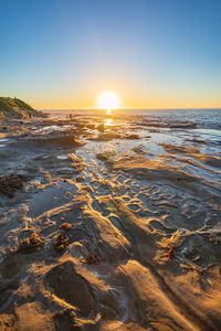 Scenic view of sea against sky during sunset