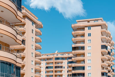 Fragments of the facades of modern multi-storey residential complexes. 