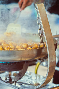 Midsection of man preparing food on street