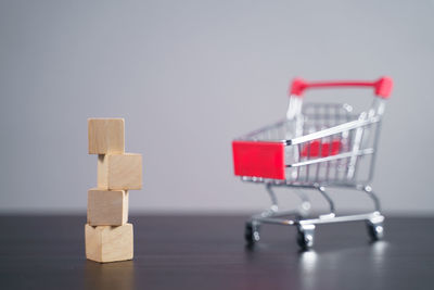 Close-up of toys on table against blue background