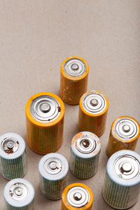 Discharged batteries in cardboard box. collecting used batteries to recycle