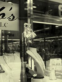 Reflection of window on display at store