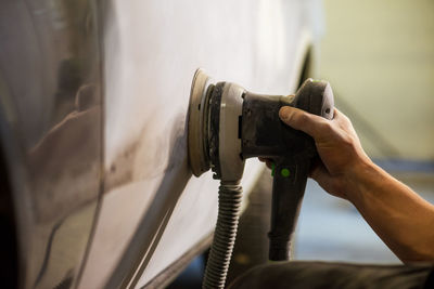 Mechanic working in auto shop.