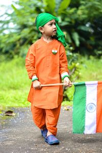 Little boy holding a flag