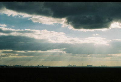 Scenic view of field against sky at sunset