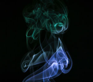 Close-up of smoke against black background