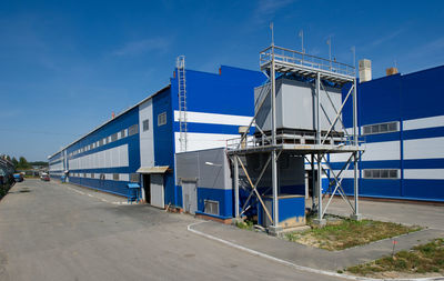 Metallurgical plant against blue sky on sunny day