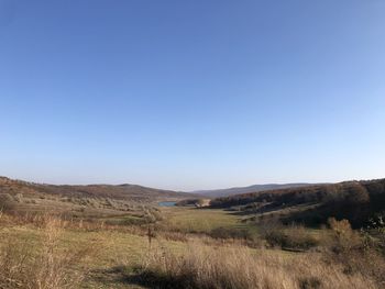 Scenic view of landscape against clear blue sky