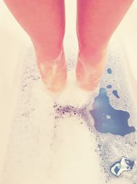 Low section of woman on water