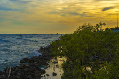 Scenic view of sea against sky during sunset