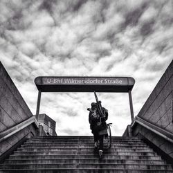 Low angle view of building against cloudy sky