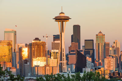 Modern buildings in city against clear sky