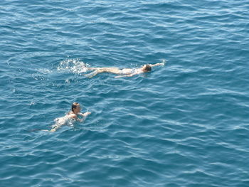 High angle view of man swimming in sea