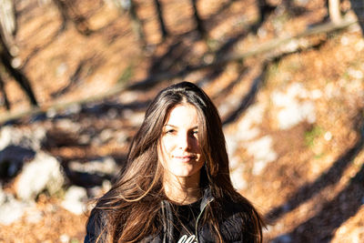 Portrait of a girl in the forest in winter