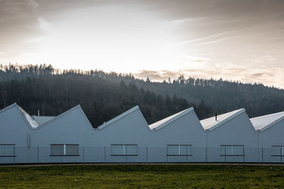 Scenic view of houses against sky