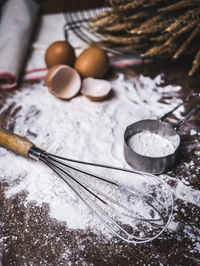 Close-up of eggs with flour on table