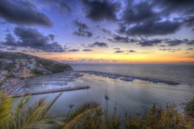 Scenic view of lake against sky during sunset