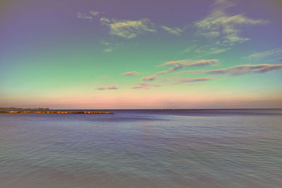 Scenic view of sea against sky at sunset